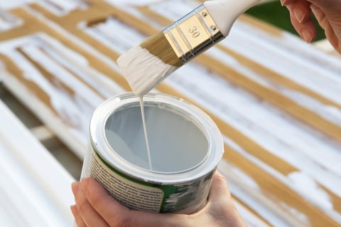 Professional painters working on house